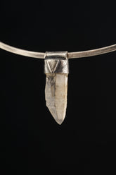 Australian Lithium Quartz Stack Pendant shown on black background with sterling silver cap and clear crystal body.