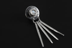 Blue Moonstone Lunar Ray pendant in high-shine 925 sterling silver, shown on black with four slender silver ray details.