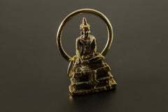 Gold-plated brass Bodhi pendant shown on a dark background, with Buddhist-inspired meditation talisman design.
