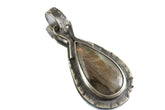 Rainbow Labradorite teardrop pendant in oxidized sterling silver with hammered circular bail.