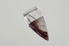 Fang Shaped Charoite Stack Pendant shown on light background with polished purple stone and textured silver cap.