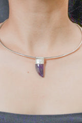 Tooth Shaped Amethyst Cabochon Stack Pendant shown worn on the chest as a purple sterling silver layering necklace.