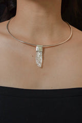 Hiddenite Stack Pendant shown worn on the chest as a soft green sterling silver layering necklace.