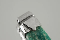 Close-up of Rough Cut Amazonite in a handmade sterling silver Stack Pendant cap with signature triangle detail.