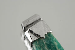Close-up of Rough Cut Amazonite in a handmade sterling silver Stack Pendant cap with signature triangle detail.