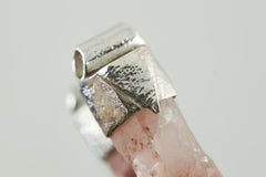 Close-up of Australian Phantom Lithium Quartz in a handmade sterling silver Stack Pendant cap with signature triangle detail.