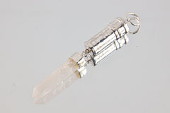 Australian Clear Quartz Capsule Pendant shown on pale background with shiny sterling silver and raw crystal point.