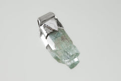 Natural Capped Aquamarine Stack Pendant shown on light background with textured sterling silver cap and soft blue-green crystal.