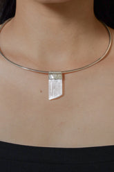 Translucent Selenite Stack Pendant shown worn on the chest with sterling silver cap and soft white crystal glow.