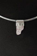Light Pink Kunzite Stack Pendant shown worn on the chest with sterling silver cap and soft pink crystal.