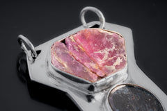Close-up of Ruby Ocean Kyanite pendant showing raw Record Keeper Ruby and polished sterling silver setting.