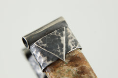 Close-up of Brown Himalayan Dravite Tourmaline in a handmade sterling silver Stack Pendant cap with signature triangle detail.