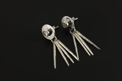 Blue Moonstone sterling silver drop earrings shown on a dark background, with round stones and long handmade silver dangles.