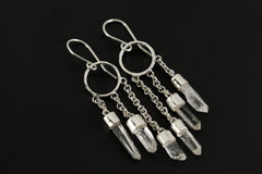 Celestial Quartz Harmony earrings in hammered 925 sterling silver shown worn on a model with cascading crystal chains.