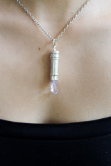 Vera Cruz Amethyst capsule pendant shown worn on a model, with silver chain and hidden keepsake vessel design.
