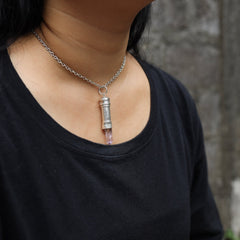 Vera Cruz Amethyst capsule pendant shown worn on a model, with silver chain and hidden keepsake vessel design.