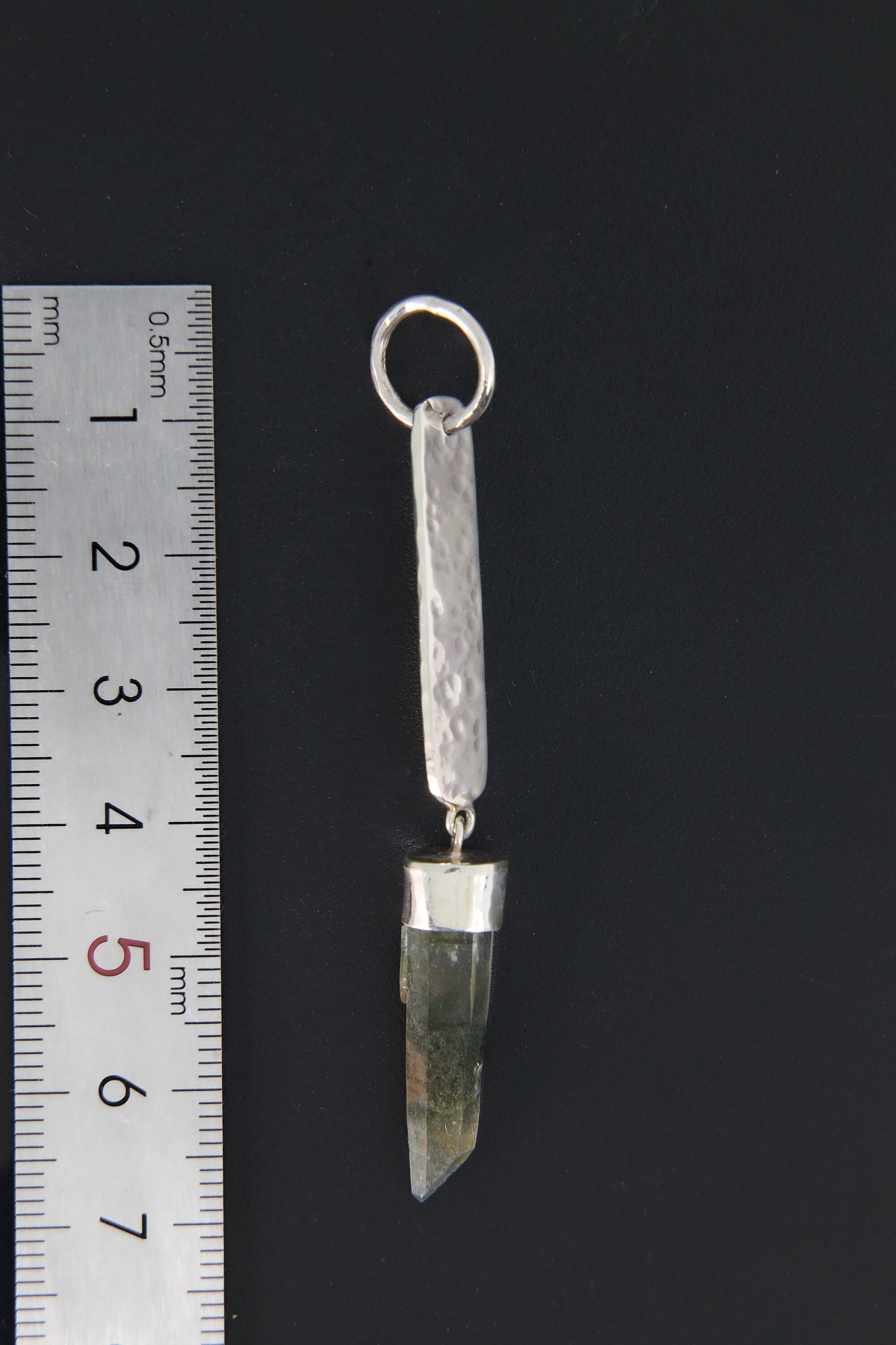 Himalayan Chlorite Quartz sterling silver pendant shown beside a ruler for scale with round bail and hammered silver body.