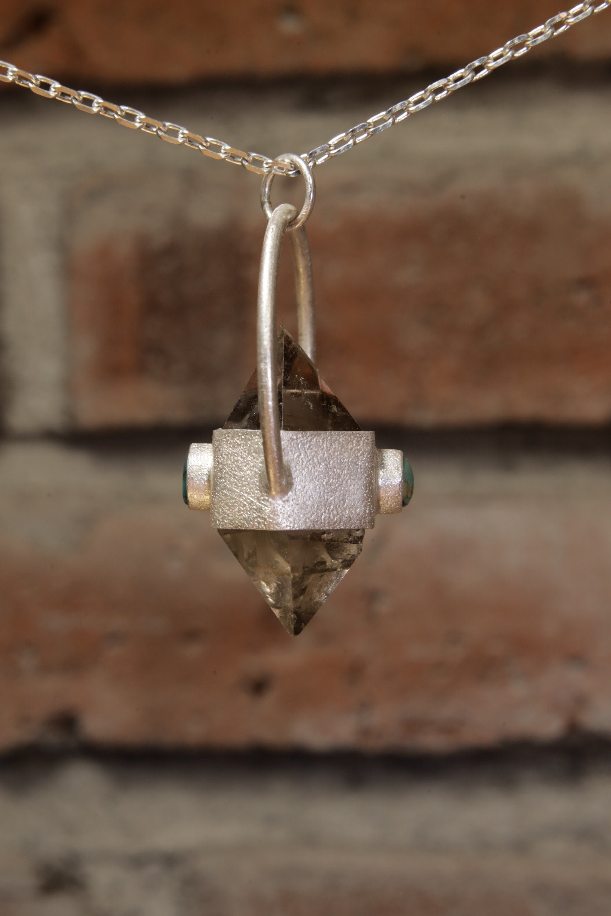 Earthen Radiance: Sterling Silver Sand-Textured Crystal Pendant with Double Terminated Cut Smokey Quartz and Persian Turquoise