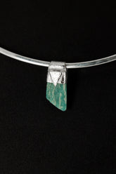 Rough Cut Amazonite Stack Pendant shown on black background with sterling silver cap and vivid blue-green feldspar stone.