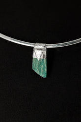 Rough Cut Amazonite Stack Pendant shown on black background with sterling silver cap and vivid blue-green feldspar stone.