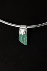 Rough Cut Amazonite Stack Pendant shown on black background with sterling silver cap and vivid blue-green feldspar stone.