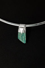 Rough Cut Amazonite Stack Pendant shown on black background with sterling silver cap and vivid blue-green feldspar stone.
