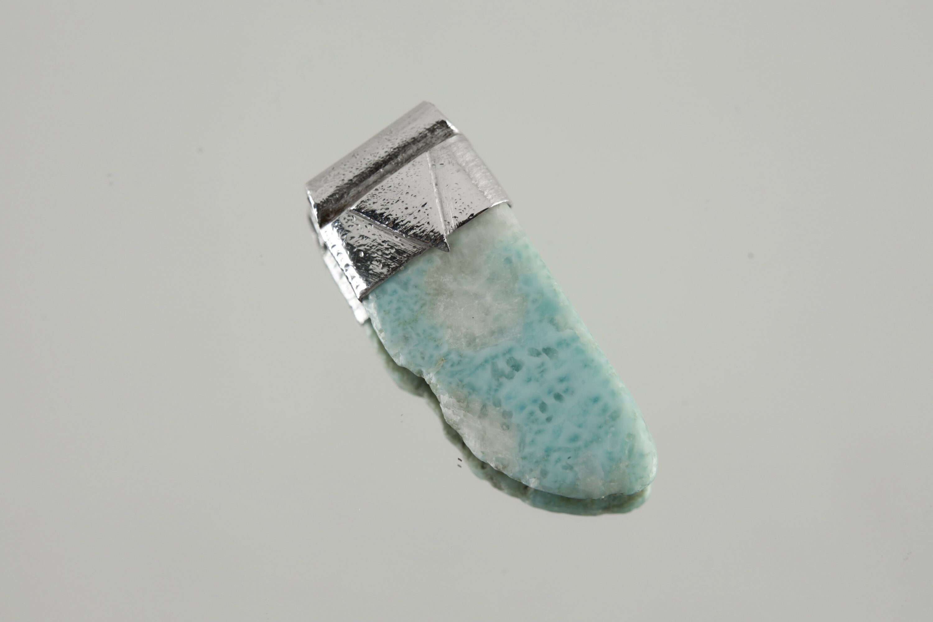 Freeform Larimar Stack Pendant shown on a light background with textured sterling silver cap and soft ocean-blue stone.