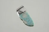 Freeform Larimar Stack Pendant shown on a light background with textured sterling silver cap and soft ocean-blue stone.