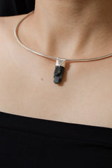 Blue Gem Apatite Stack Pendant shown worn on the chest with sterling silver cap and vivid blue-green crystal.