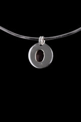 Back view of Ruby Cabochon pendant showing smooth polished sterling silver surface and twin circular bails.