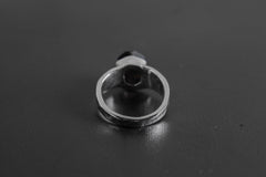 Back view of Black Tourmaline sterling silver ring showing the circular band and handmade hammered silver texture.