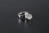 Handmade 925 sterling silver Cacoxenite Quartz point ring shown on a dark background, with clear crystal point and hammered band.