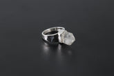 Handmade 925 sterling silver Cacoxenite Quartz point ring shown on a dark background, with clear crystal point and hammered band.