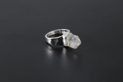 Handmade 925 sterling silver Cacoxenite Quartz point ring shown on a dark background, with clear crystal point and hammered band.