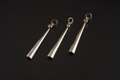 Three Herkimer Diamond spoon pendants shown together on dark background with polished sterling silver scoop forms.
