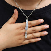 Australian Aquamarine sterling silver pendant worn on a model with hammered rectangular silver plate and pale blue crystal.