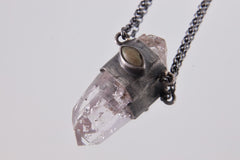 Vera Cruz Amethyst Ethiopian Opal Pendant shown on light background with hammer-textured silver wrap and luminous Opal accent.