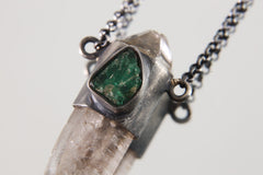 Close-up of Vera Cruz Amethyst Emerald Pendant showing oxidized sterling silver wrap and green Emerald accent.