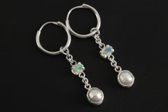 Celestial Cascade Opal and Pearl hoop earrings shown on a dark background with sterling silver hoops and gemstone drops.