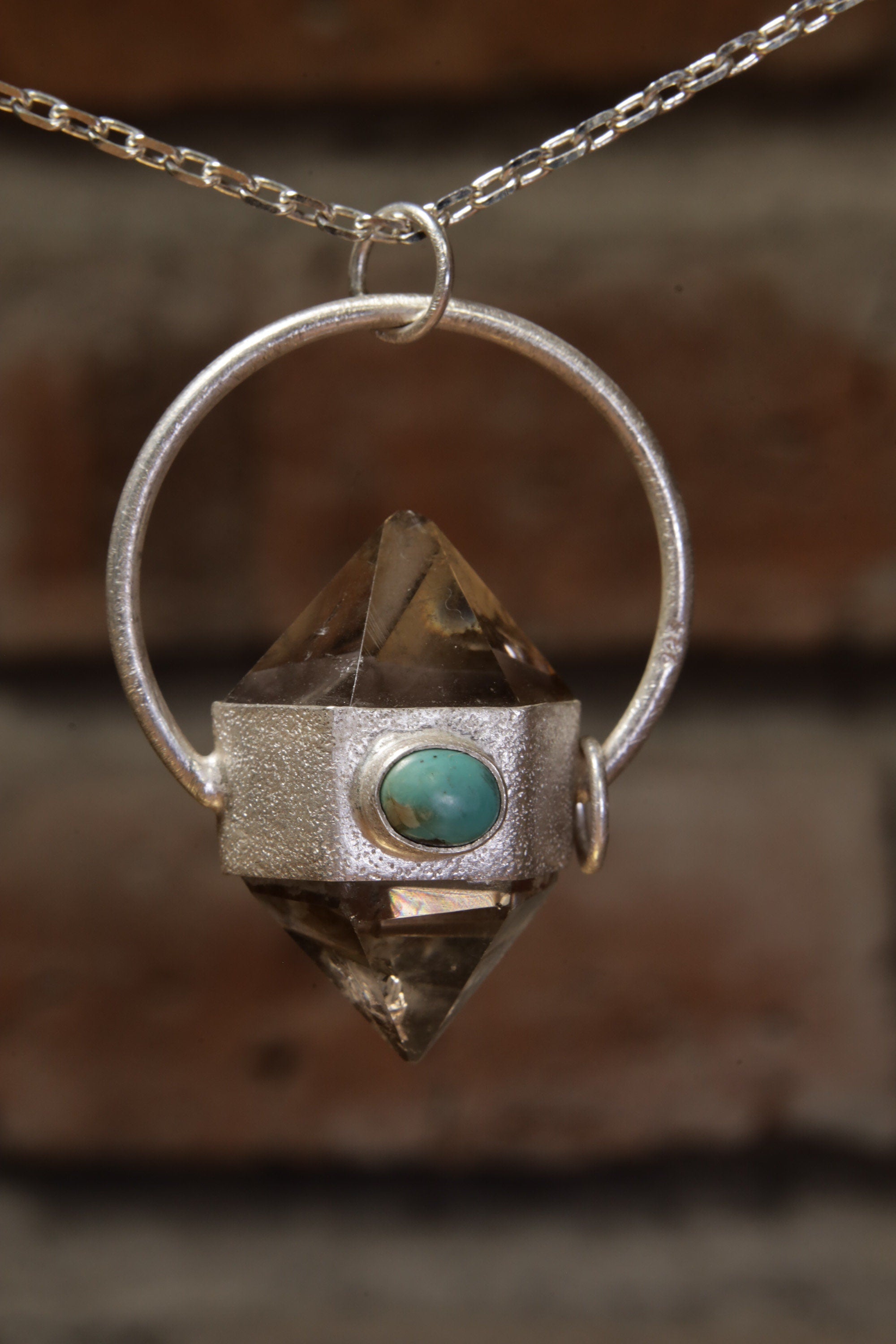 Earthen Radiance: Sterling Silver Sand-Textured Crystal Pendant with Double Terminated Cut Smokey Quartz and Persian Turquoise