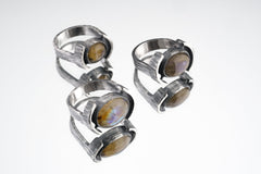 Oval Labradorite Oxidized Silver Ring shown on white background with layered bezel setting and rugged silver texture.