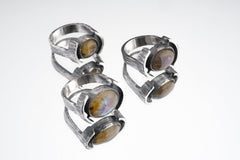 Oval Labradorite Oxidized Silver Ring shown on white background with layered bezel setting and rugged silver texture.
