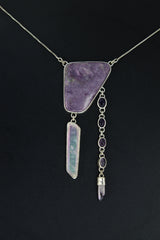 Charoite Angel Aura Quartz Amethyst pendant shown worn on a dark background with violet stones and high-shine silver.