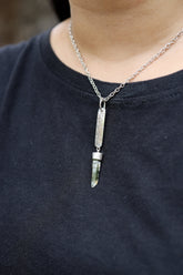 Himalayan Chlorite Quartz sterling silver pendant worn on a model with hammered rectangular silver detail.