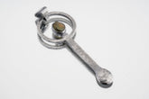 Peridot oxidized sterling silver ritual spoon shown on white background with hammered silver and green gemstone setting.