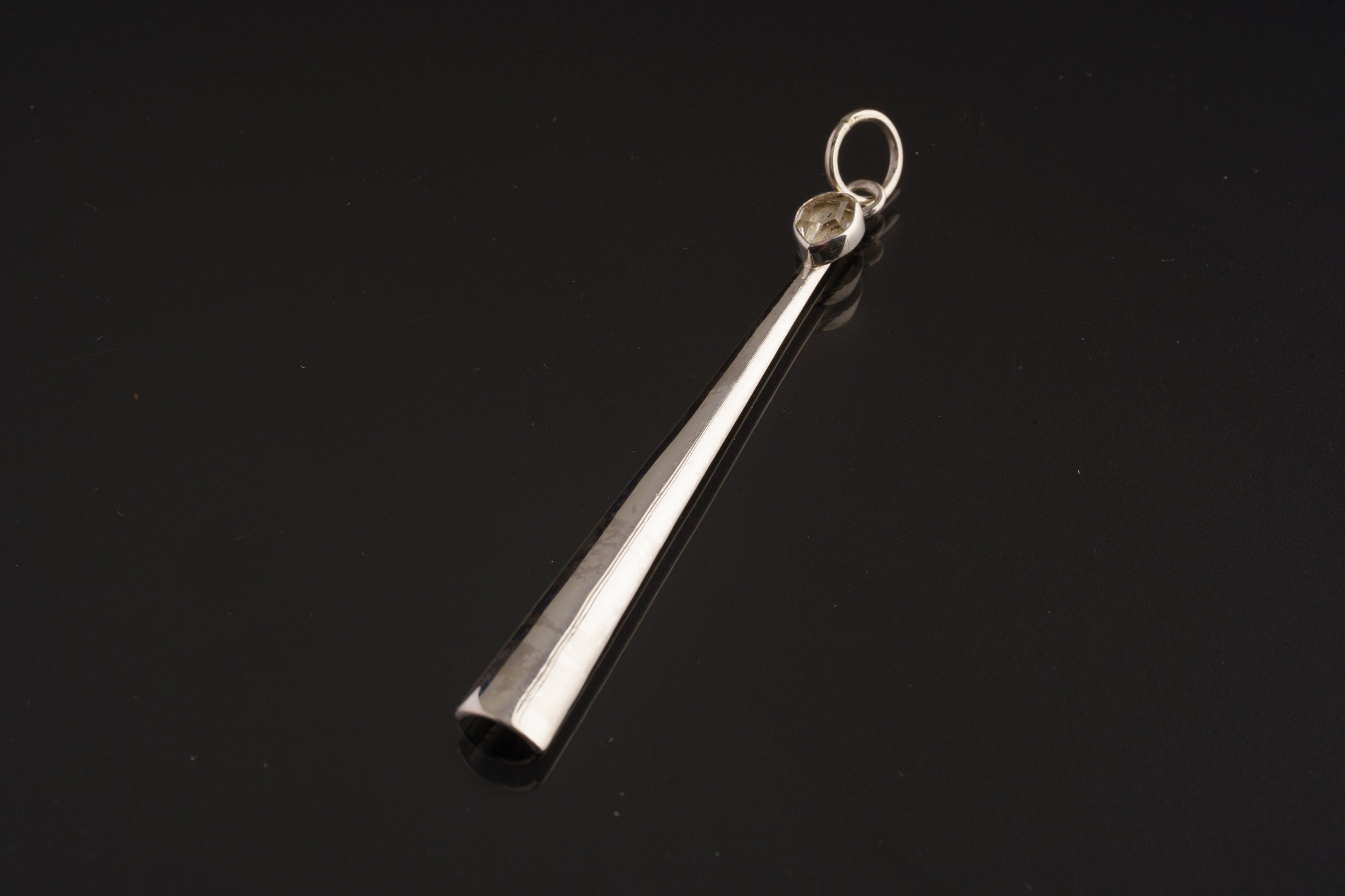 Herkimer Diamond sterling silver spoon pendant shown on dark background with high-shine silver and crystal crown.