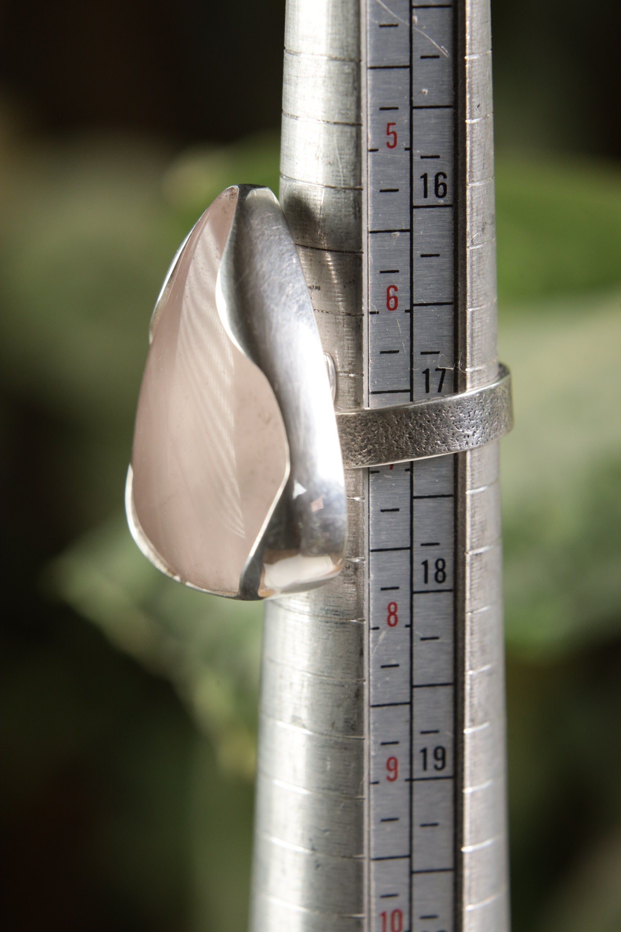 Triangular Rose Quartz adjustable ring shown beside a ruler, with high-shine 925 sterling silver and soft pink stone.