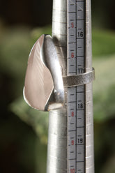 Triangular Rose Quartz adjustable ring shown beside a ruler, with high-shine 925 sterling silver and soft pink stone.