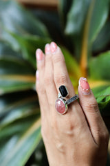 Dravite Tourmaline Sunstone ring shown worn on the hand, with earthy brown and warm orange stones in sterling silver.