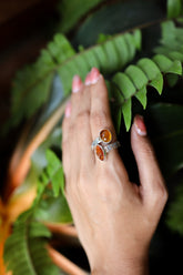 Red Kyanite Ethiopian Kyanite adjustable ring shown worn on the hand, with high-shine 925 sterling silver and oxidized texture.